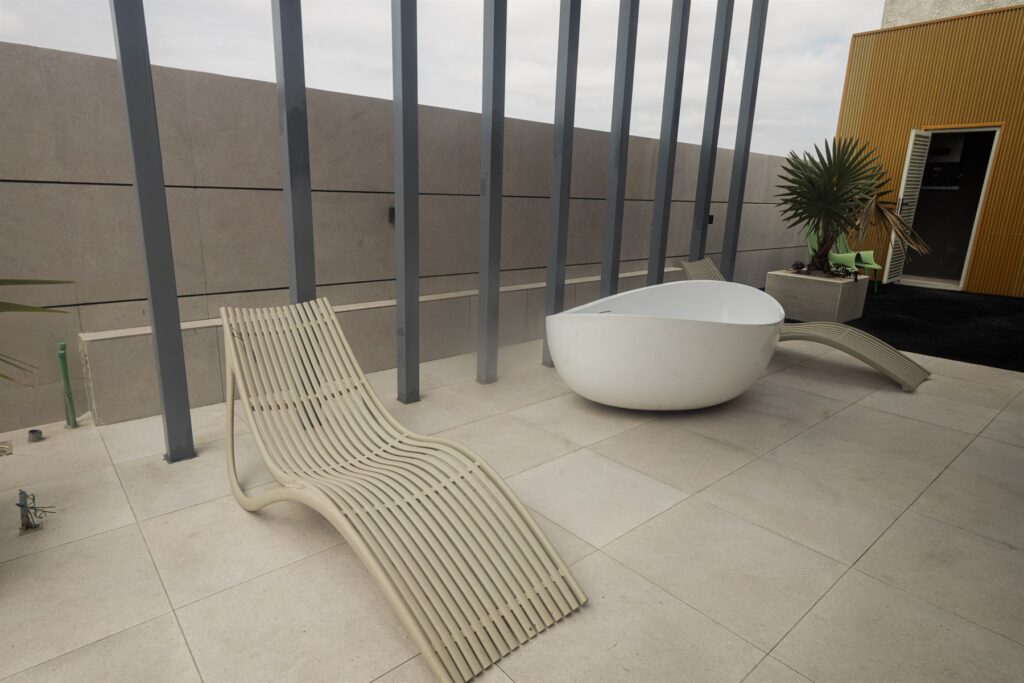 Brum Height 6: Rooftop relaxation area with loungers, planting and a tub